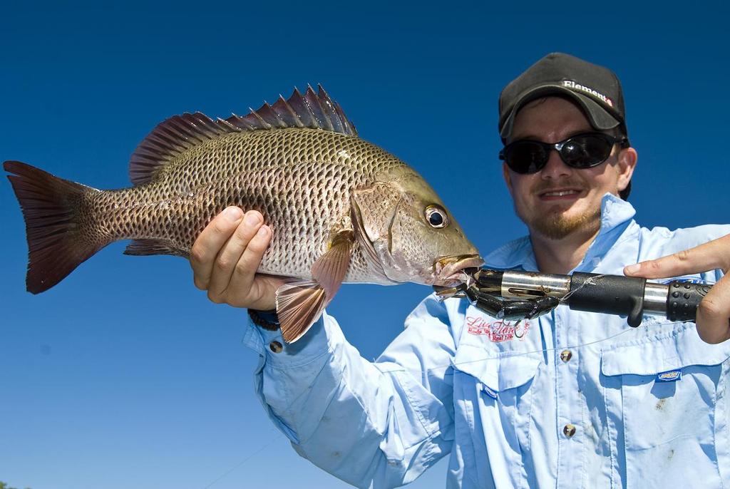 Casting lures around the rocky flats and points of the islands is a top way to land some nice mangrove jack.   © Lee Brake